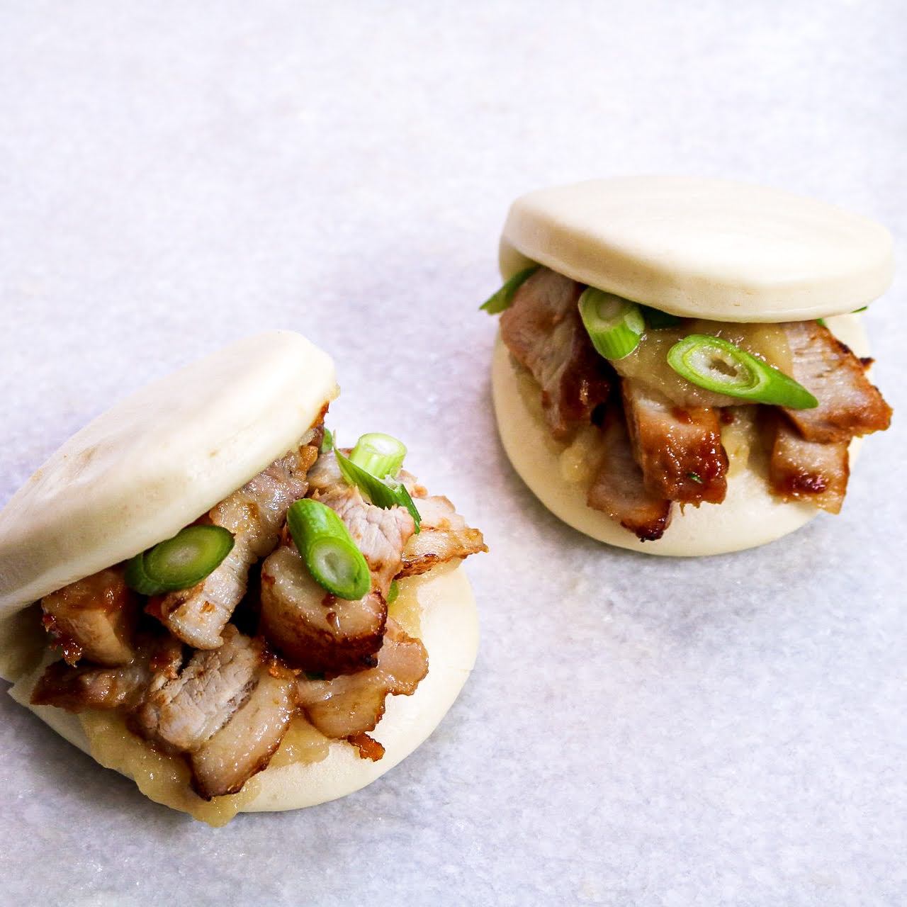 two filled Bao on table