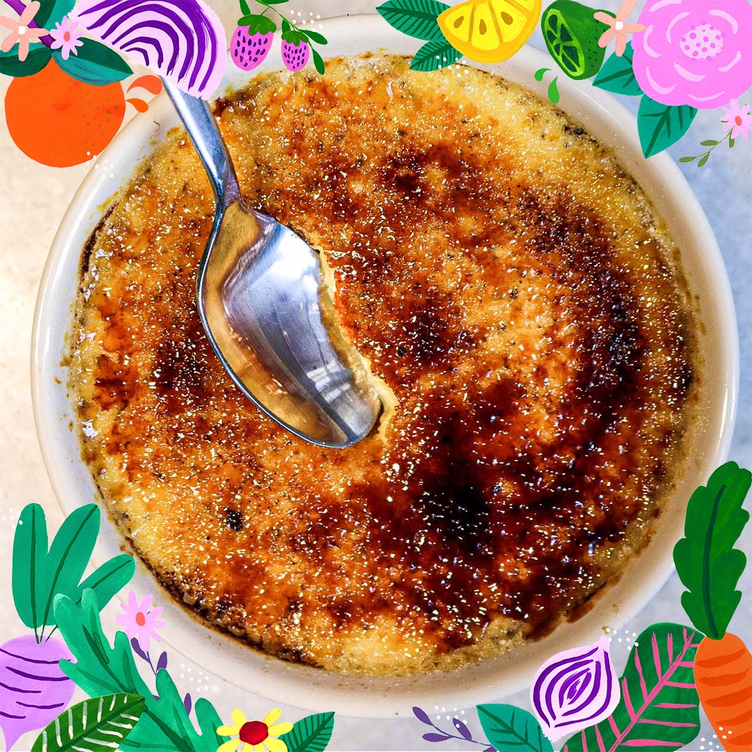 spoon cracking into Crème brûlée