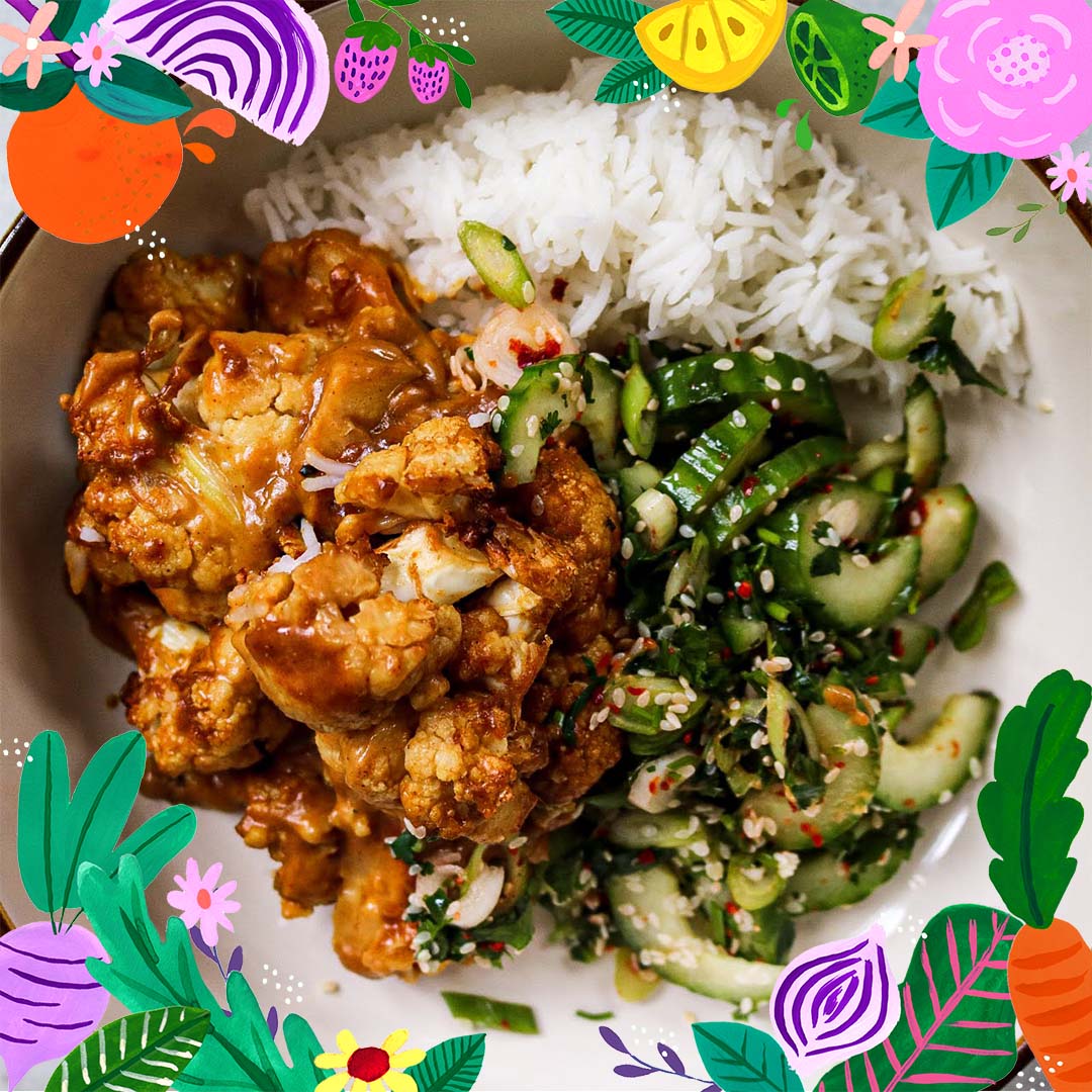 Dish of cauliflower satay and cucumber salad